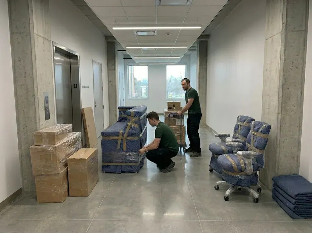 Professional movers securing a large item for transport in Markham